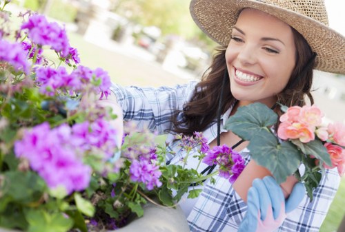 Gardener working on a compact Walthamstow terrace garden